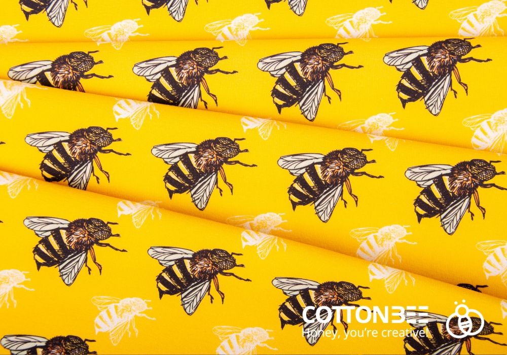 Bees on yellow fabric