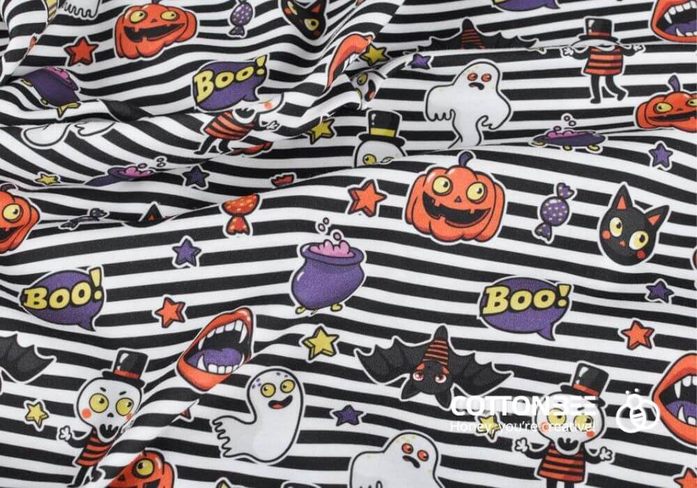 striped sewing fabric with ghosts, pumpkins, cats and sweets
